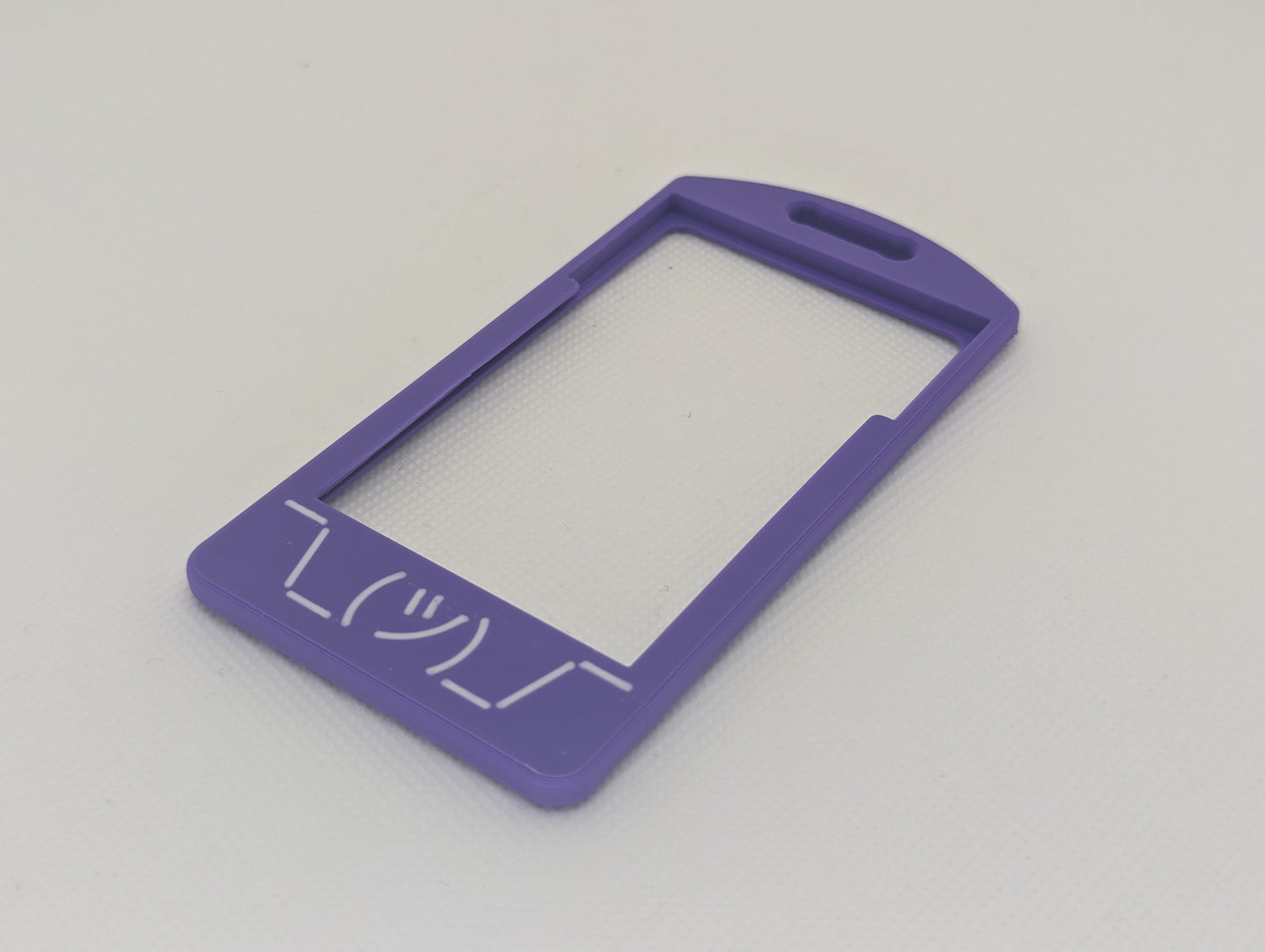 White shruggie flat on purple badge