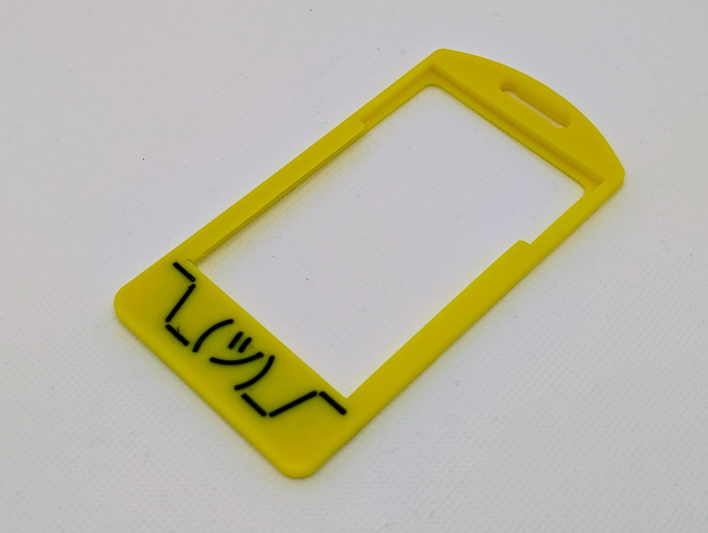 Black shruggie flat on yellow badge